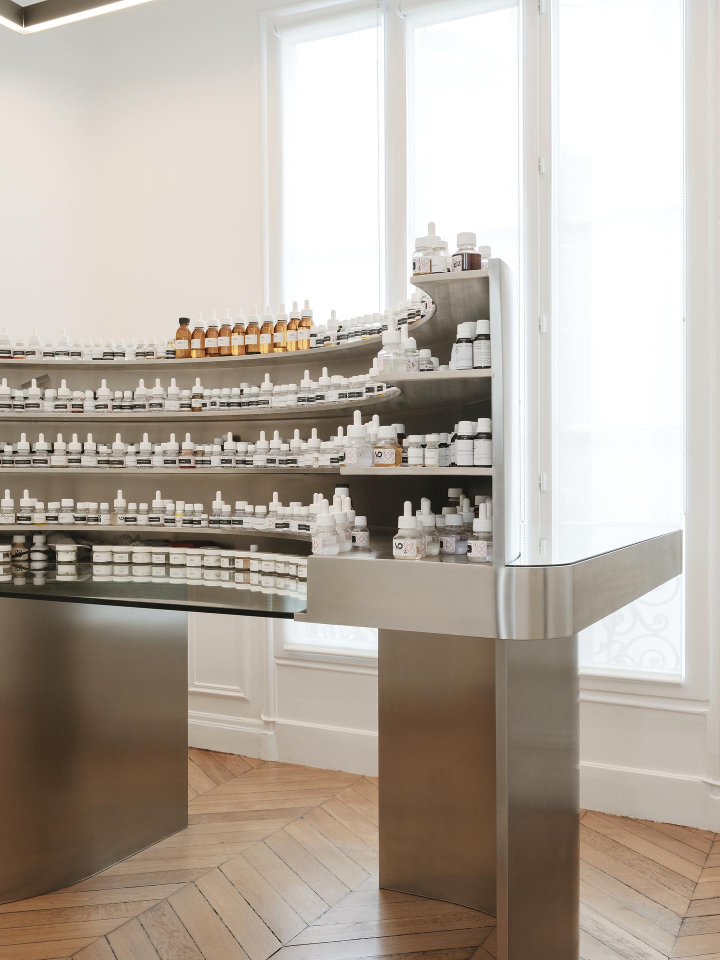 Perfumer's organ with rows of labelled composition bottles